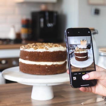 Taking a picture of a cake