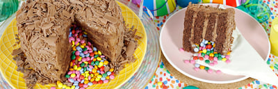 Last Minute Cakes - Generic Pinata Cake - Chocolate cake covered in chocolate flakes with multi-coloured chocolate beans inside -  Blog banner