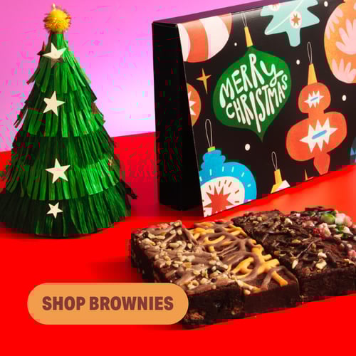 Letterbox christmas brownies with a tree next to it and a button saying 'shop brownies'overlayed