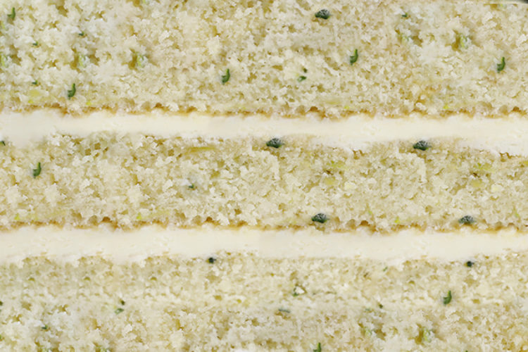 Zucchini/courgette and lime buttercream close up between sponge cake layers